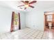 Bedroom features a ceiling fan, tile flooring and access to bathroom at 3556 Riley Rd, Douglasville, GA 30134