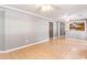 Open living room featuring tile flooring and a pass-through to the kitchen at 3556 Riley Rd, Douglasville, GA 30134