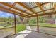 Covered patio with wooden deck and views of the grassy yard at 3556 Riley Rd, Douglasville, GA 30134