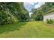 Expansive backyard with lush green grass and mature trees offering plenty of space at 58 Bisbee Se Ave, Atlanta, GA 30315