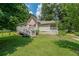 The home features a spacious backyard, complete with a wooden ramp and lush green grass at 58 Bisbee Se Ave, Atlanta, GA 30315