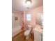 This bathroom has a shower/tub combination and a pedestal sink at 58 Bisbee Se Ave, Atlanta, GA 30315