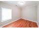 Bedroom with hardwood floors and a large window at 58 Bisbee Se Ave, Atlanta, GA 30315