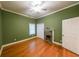 This bedroom has hardwood floors, a fireplace and a ceiling fan at 58 Bisbee Se Ave, Atlanta, GA 30315