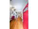 The foyer features gleaming hardwood floors, and a red door at 58 Bisbee Se Ave, Atlanta, GA 30315