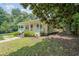 This home has a charming front porch, complemented by a lush, green lawn at 58 Bisbee Se Ave, Atlanta, GA 30315