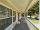 Inviting front porch features a chair and views of the charming neighborhood at 58 Bisbee Se Ave, Atlanta, GA 30315