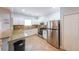 Well-equipped kitchen with stainless steel appliances, granite countertops and tile floors at 58 Bisbee Se Ave, Atlanta, GA 30315
