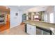 Open-concept area showcasing kitchen with granite counter tops and view to the dining room at 58 Bisbee Se Ave, Atlanta, GA 30315