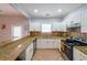Modern kitchen with white cabinets, granite countertops, and stainless steel appliances at 58 Bisbee Se Ave, Atlanta, GA 30315