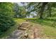 A set of rock stairs ascends through lush greenery in this scenic park setting at 58 Bisbee Se Ave, Atlanta, GA 30315