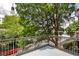 Balcony with metal railings overlooking a street with lush trees and views of the surrounding area at 791 Wylie Se St # 404, Atlanta, GA 30316