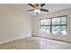 Bedroom featuring a ceiling fan and a large window providing natural light and street views at 791 Wylie Se St # 404, Atlanta, GA 30316