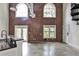Spacious living room with large windows, exposed brick, and modern industrial design at 791 Wylie Se St # 404, Atlanta, GA 30316