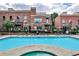 Exterior shot of swimming pool with lounge seating and brick apartment buildings in the background at 791 Wylie Se St # 404, Atlanta, GA 30316