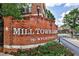 Mill Town Lofts entrance featuring a brick sign and well-maintained landscaping at 791 Wylie Se St # 404, Atlanta, GA 30316