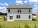 Spacious backyard of a two-story home with manicured lawn at 8215 Coldstream Dr, Fairburn, GA 30213