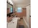 A cozy bathroom featuring salmon-colored tile, a bath tub and shower at 1327 Rupert Rd, Decatur, GA 30030