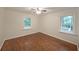 Bedroom with hardwood floors, two windows, and neutral walls at 1327 Rupert Rd, Decatur, GA 30030