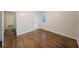 Bedroom features hardwood floors, a window, and a spacious closet at 1327 Rupert Rd, Decatur, GA 30030