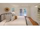 Bedroom with wood floors, white walls, and French doors that lead to the exterior at 1327 Rupert Rd, Decatur, GA 30030