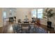 Cozy dining room featuring modern decor, a round glass table, and hardwood floors for elegant meals at 1327 Rupert Rd, Decatur, GA 30030