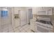 Bright kitchen with white cabinets, gas range, and refrigerator at 1327 Rupert Rd, Decatur, GA 30030
