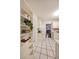 Kitchen featuring white cabinets, tiled floor, and bookshelf at 1327 Rupert Rd, Decatur, GA 30030