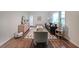 Bright living room with hardwood floors, stylish furniture, and large windows allowing for natural light at 1327 Rupert Rd, Decatur, GA 30030
