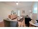 Bright living room with hardwood floors, stylish furniture, and large windows allowing for natural light at 1327 Rupert Rd, Decatur, GA 30030