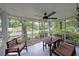 Enclosed porch with wood furniture and serene outdoor views through screened windows at 1327 Rupert Rd, Decatur, GA 30030
