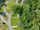 Aerial view of homes in a tree-lined neighborhood, showcasing their location and landscaping at 1735 Carter Cir, Atlanta, GA 30344