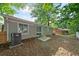Backyard featuring a grassy area, a patio, and mature trees at 1735 Carter Cir, Atlanta, GA 30344