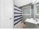 Bathroom with a blue and white stripped shower curtain at 1735 Carter Cir, Atlanta, GA 30344