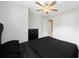 Bedroom features light wood flooring, neutral walls, fan, and closet access at 1735 Carter Cir, Atlanta, GA 30344