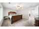 Bedroom features a wood frame bed, wood flooring, and natural light at 1735 Carter Cir, Atlanta, GA 30344
