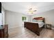 Bedroom showcases a wood frame bed, wood flooring, and natural light, creating a cozy retreat at 1735 Carter Cir, Atlanta, GA 30344