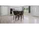 An open concept dining area features lots of space and laminate wood flooring at 1735 Carter Cir, Atlanta, GA 30344