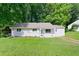 Lovely single-story home with a well-manicured lawn and mature trees in a quiet neighborhood at 1735 Carter Cir, Atlanta, GA 30344