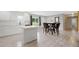 Bright, open kitchen with white cabinets, an island, and modern fixtures at 1735 Carter Cir, Atlanta, GA 30344