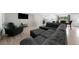 Open-concept living space featuring a sectional sofa, TV, and kitchen view at 1735 Carter Cir, Atlanta, GA 30344