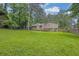 View of the house from the backyard featuring green lawn at 6503 Tent Valley Dr, Riverdale, GA 30296