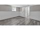 Finished basement featuring modern flooring, neutral paint and white trim at 6503 Tent Valley Dr, Riverdale, GA 30296