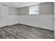 Finished basement featuring modern flooring, neutral paint and white trim at 6503 Tent Valley Dr, Riverdale, GA 30296