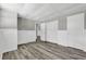 Finished basement with wood-look flooring, closet, and fresh white trim and doors at 6503 Tent Valley Dr, Riverdale, GA 30296