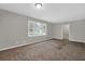 Bedroom with tan carpet and large window bringing in lots of natural light at 6503 Tent Valley Dr, Riverdale, GA 30296