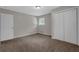Bedroom featuring carpeted floor and closet at 6503 Tent Valley Dr, Riverdale, GA 30296
