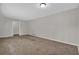Bedroom featuring tan carpet, neutral paint, and a ceiling light at 6503 Tent Valley Dr, Riverdale, GA 30296
