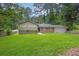 Two-story home featuring well-manicured front lawn, brick facade, and neutral siding at 6503 Tent Valley Dr, Riverdale, GA 30296