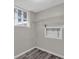The laundry room has gray vinyl flooring and overhead shelving, plus hookups for a washer and dryer at 6503 Tent Valley Dr, Riverdale, GA 30296